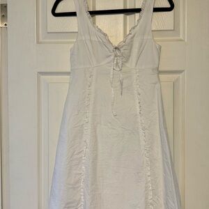 White Sleeveless Dress with Ruffle Details
XS